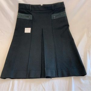 Theory - Black wool with leather zippered front pockets.  Front long pleat.